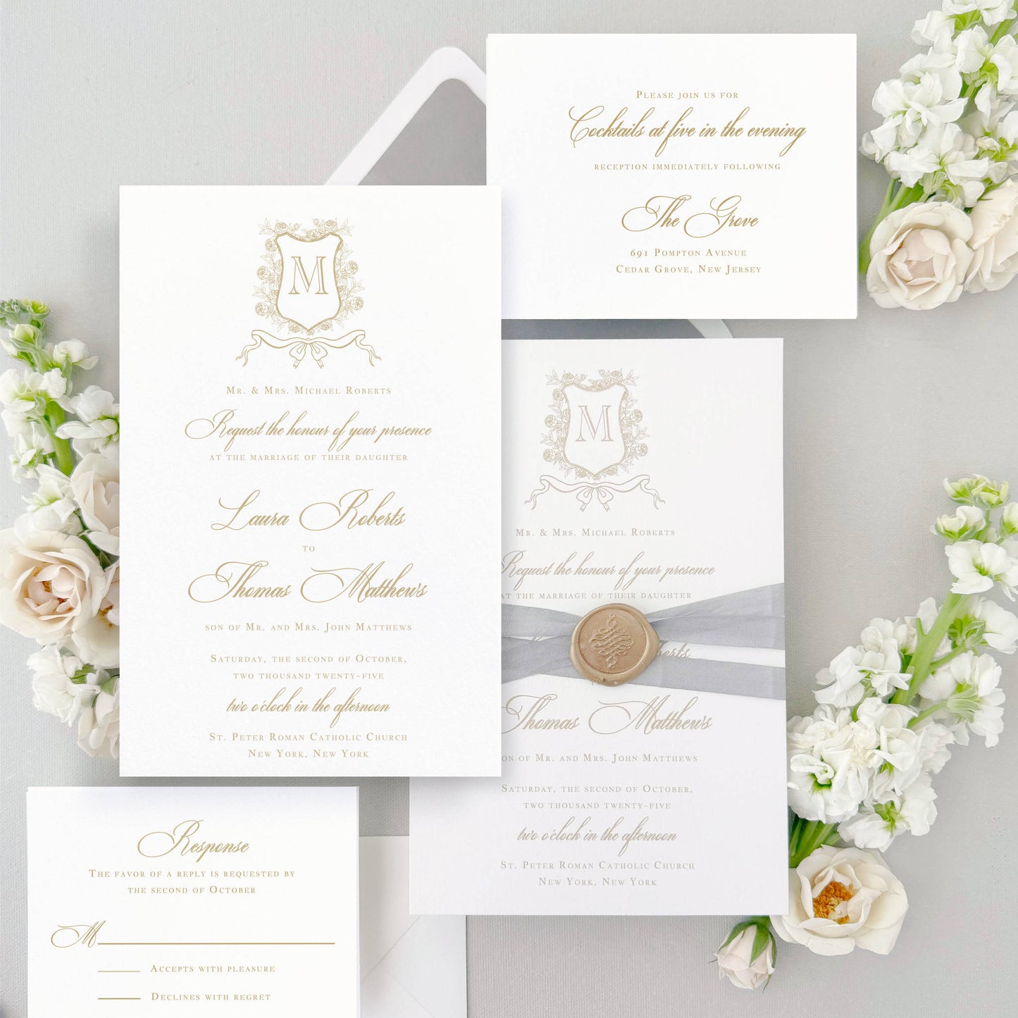 Classic wedding invitation featuring a Floral Monogram Crest with bow under it. Shown in gold ink features elegant script type. The photo displays 5piece suite- Invitation card & envelope, reception details card, as well as rsvp card & envelope. Optional embellishment shown is gray silk ribbon wrap finished with a gold wax seal. The envelope liner is gray velvet envelope liner. The name of this collection is Sofia. It is part of semi-custom wedding invitation collection.